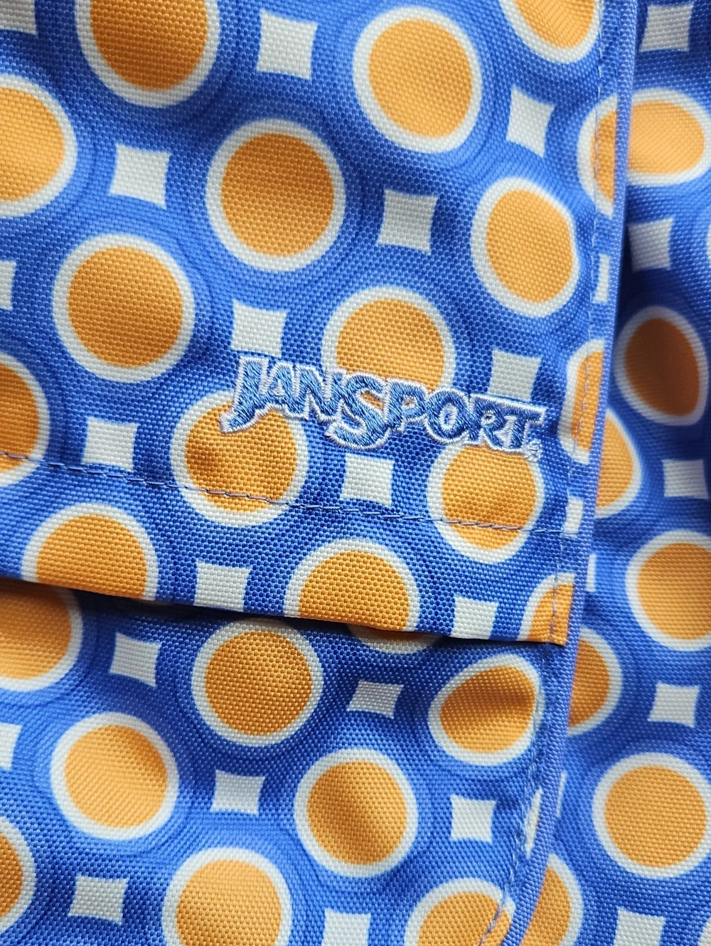 JanSport Kids Boardwalk Sling Backback in White and Fiji Orange Double Dot NWT